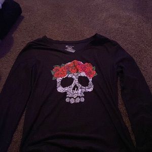 Black long sleeve shirt with a skull on the front. Brand: no boundaries Size: L